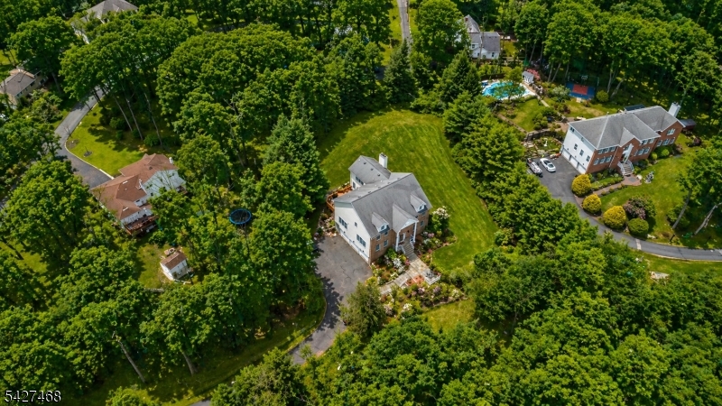 20 Sleepy Hollow Road Denville, NJ 07834 - Photo 48 of 49 an aerial view of a house with a yard and swimming pool