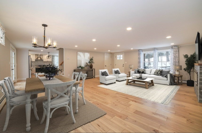 3 Woods Road Westminster, MA 01473 - Photo 10 of 42 a view of a dining room and livingroom with furniture wooden floor a chandelier