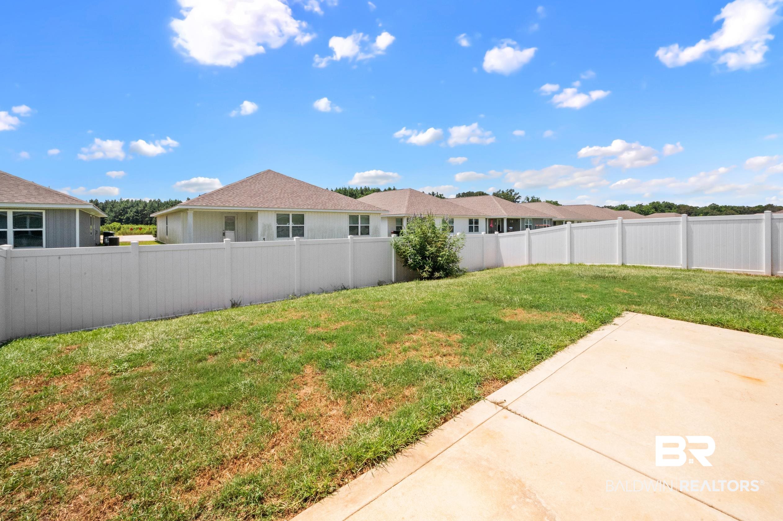 10353 Zenyatta Loop Daphne, AL 36526 - Photo 30 of 33 View of yard featuring a patio area