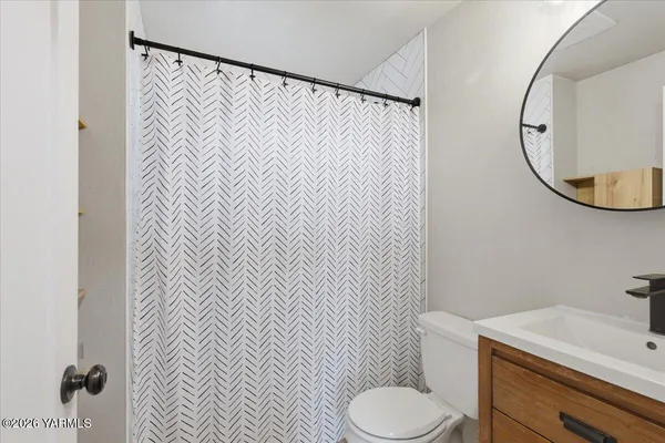 a bathroom with a bathtub and shower