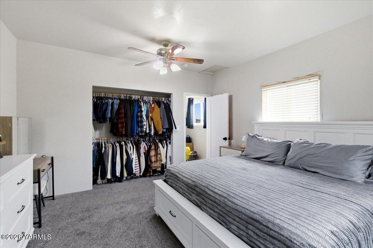 23 Shafer Avenue Naches, WA 98937 - Photo 16 of 29 a bedroom with a large bed and a window