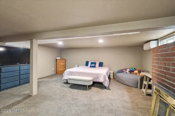 a bedroom with a bed and a cabinets