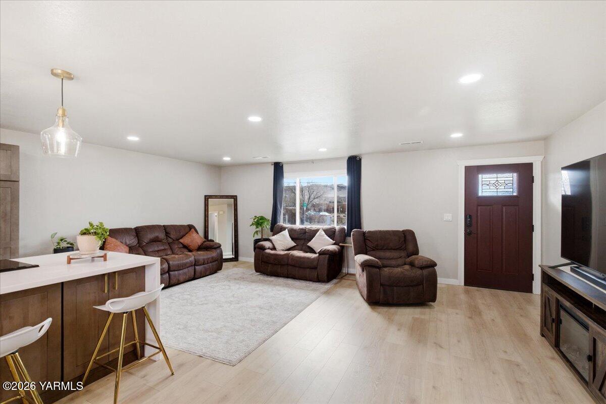 23 Shafer Avenue Naches, WA 98937 - Photo 7 of 29 a living room with furniture a large window and a flat screen tv