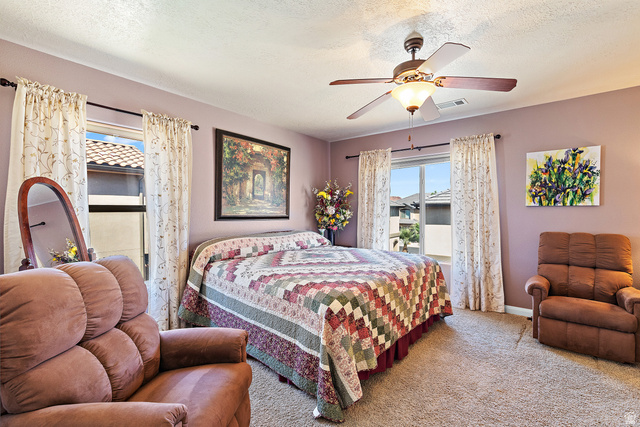 2484 Manzoni Road Santa Clara, UT 84765 - Photo 18 of 27 Carpeted bedroom featuring a ceiling fan and a textured ceiling