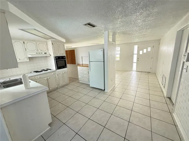an empty room & glass door in a room