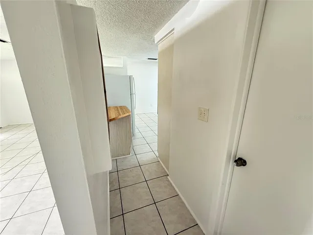 a kitchen with white cabinets a sink and appliances