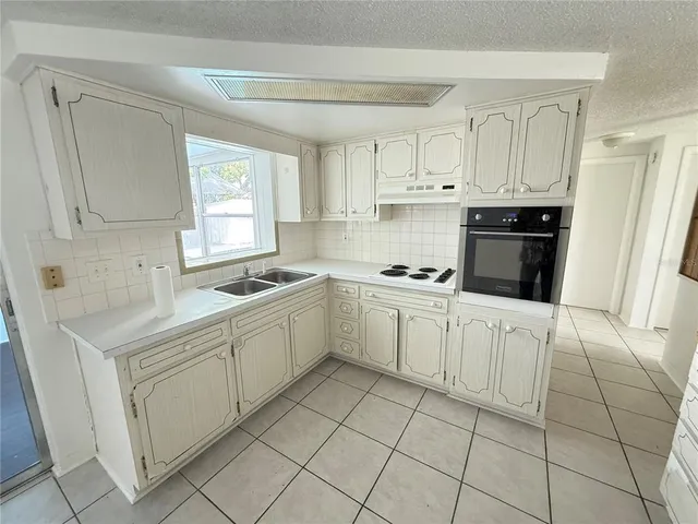 a view of an empty room and a window