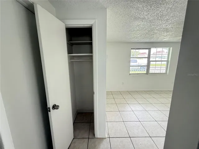 a view of an empty room with a window