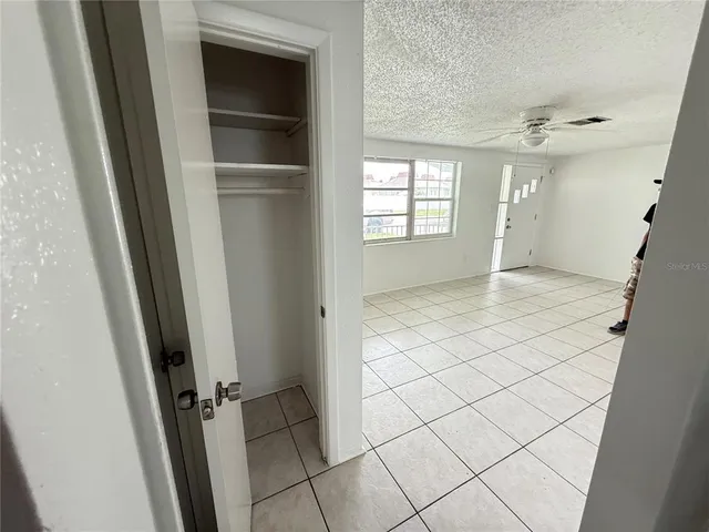 a view of an empty room with a window