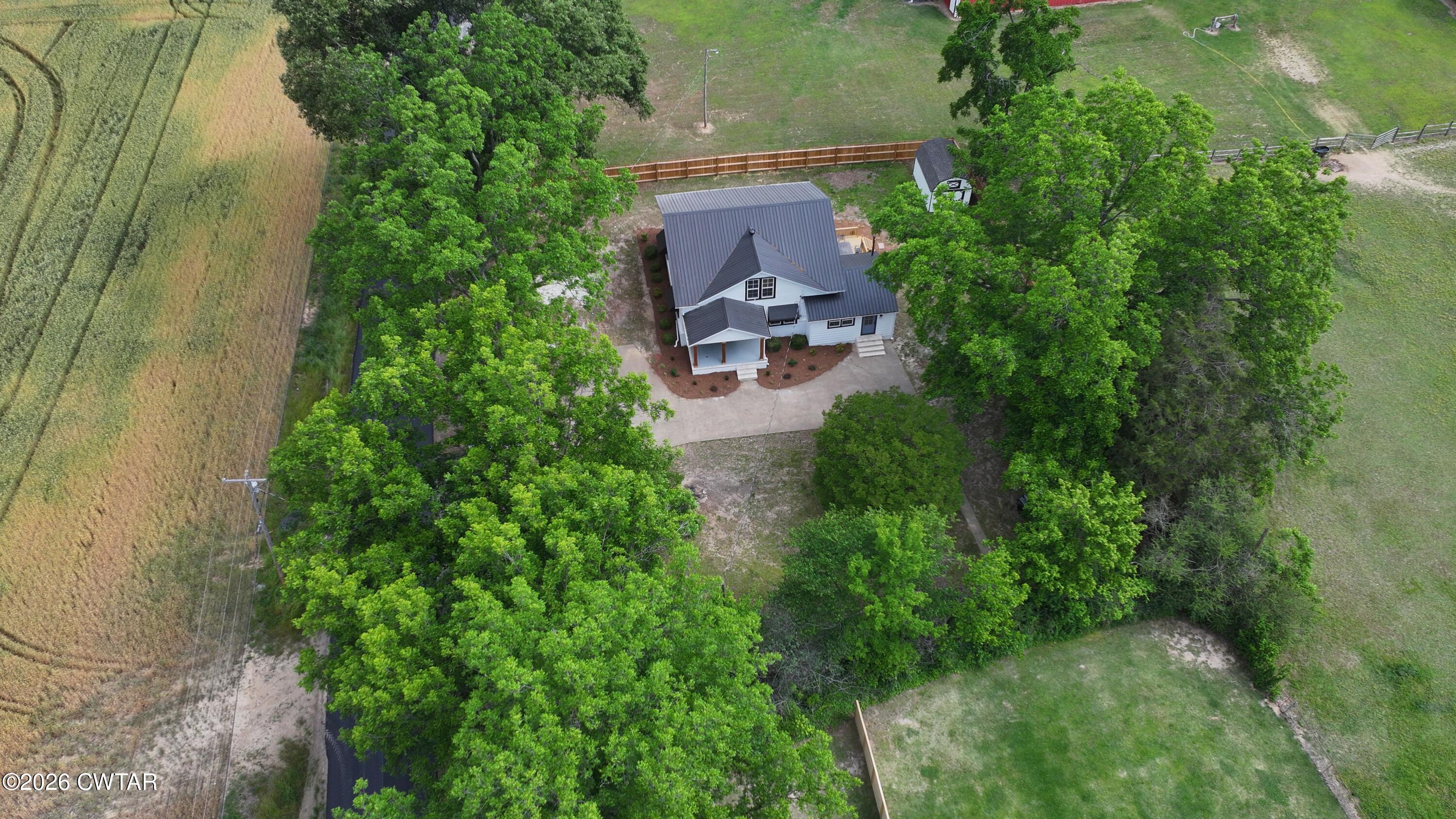 16 Manner Frank Road Milan, TN 38358 - Photo 23 of 25 an aerial view of a house with outdoor space and street view