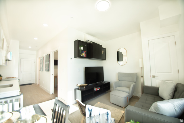 2085 North Main Street, Unit 412 Sunset, UT 84015 - Photo 9 of 14 Open-concept living area with light wood-finish flooring