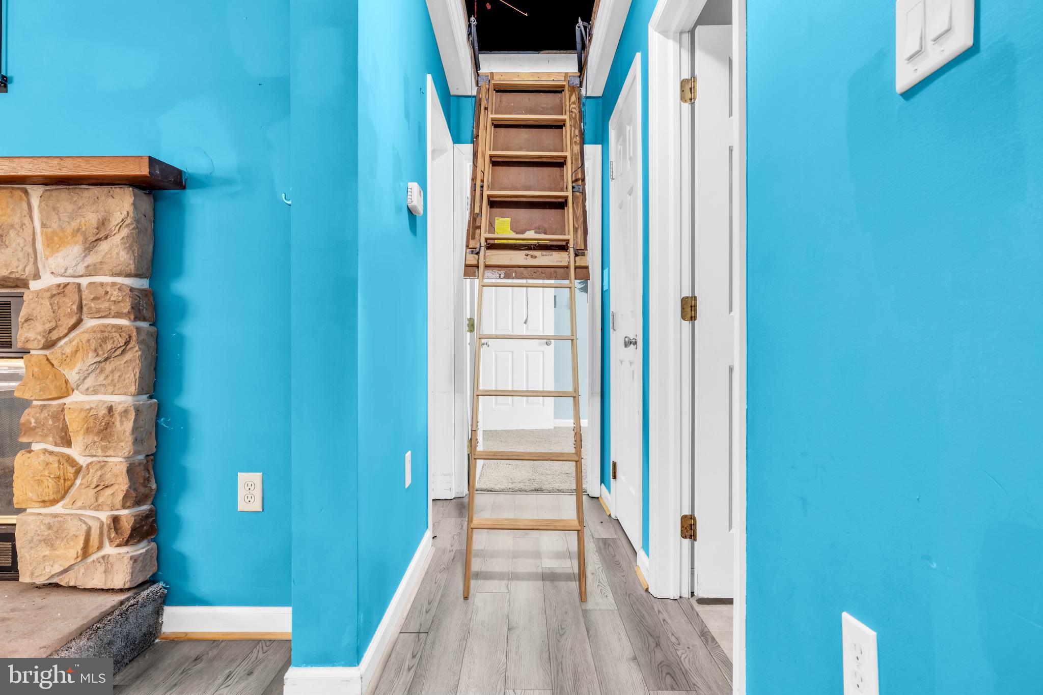 7392 Todds Wharf Road Preston, MD 21655 - Photo 32 of 63 View of attic stairs in hallway from LR