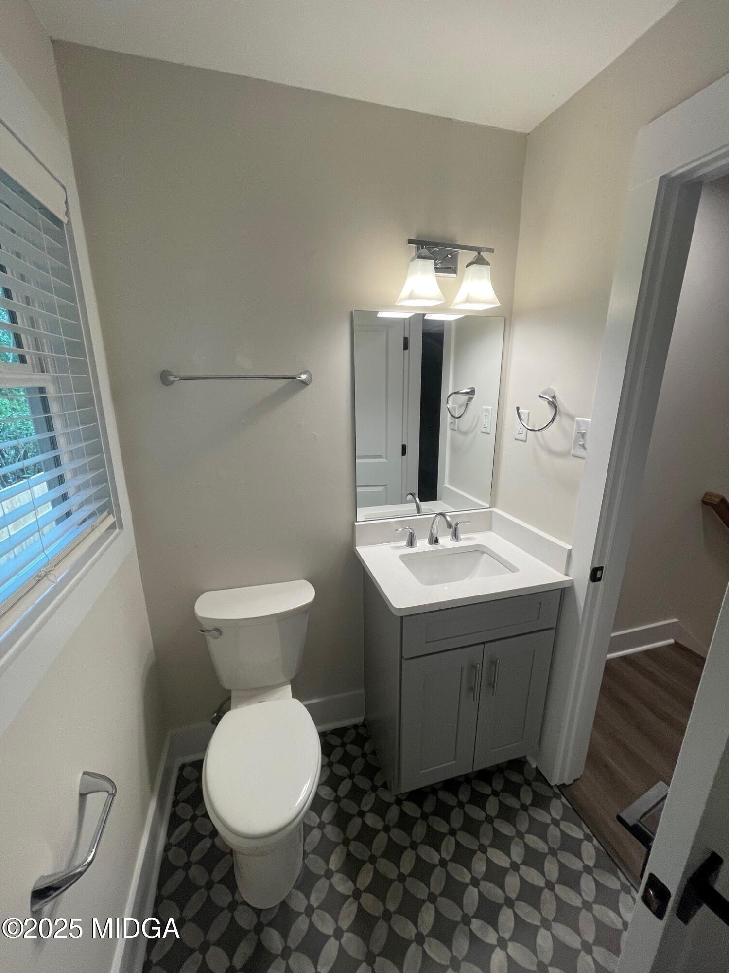 2375 Parker Avenue, Unit 2 Macon, GA 31204 - Photo 12 of 16 a bathroom with a sink toilet and shower