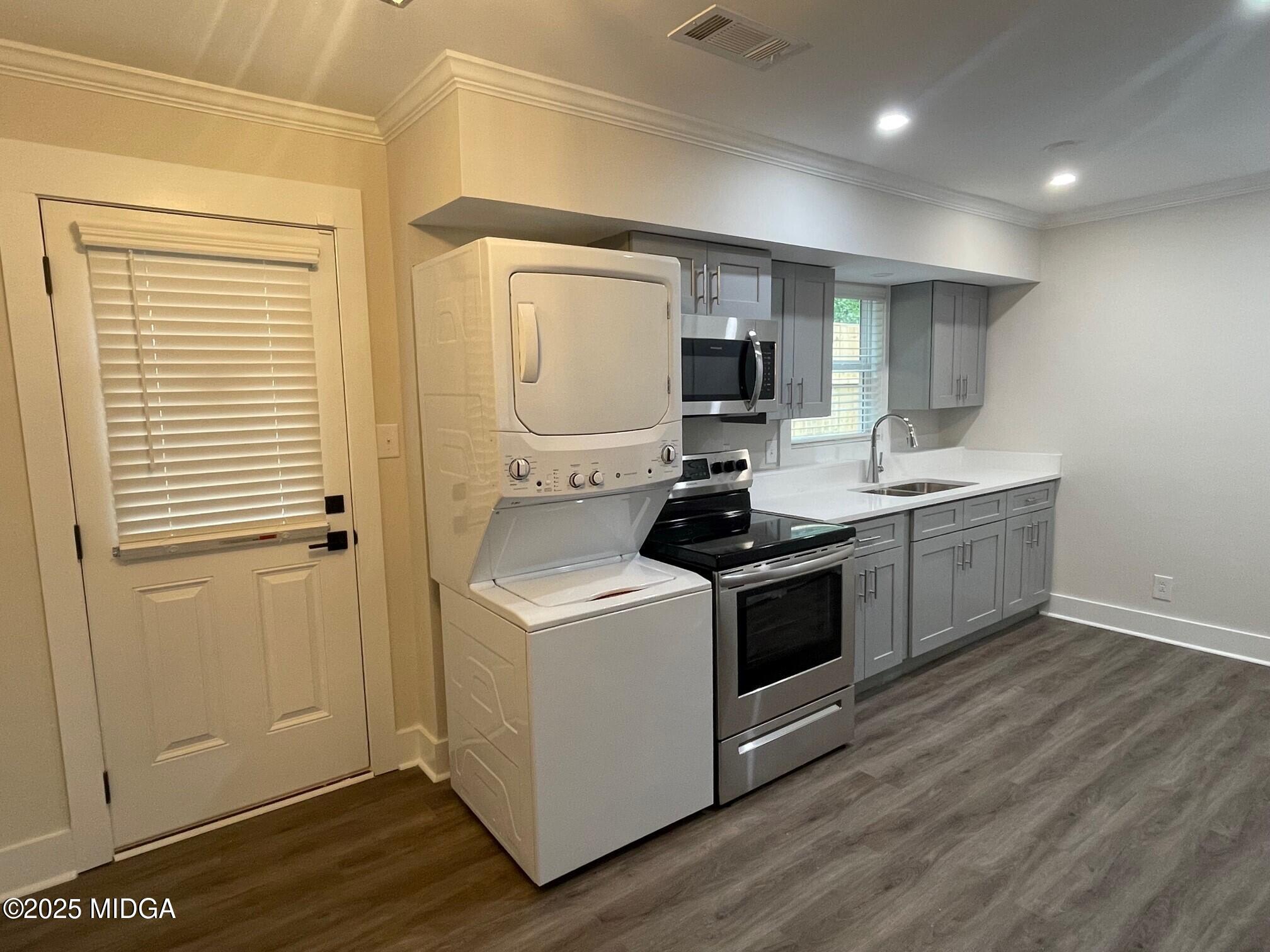 2375 Parker Avenue, Unit 2 Macon, GA 31204 - Photo 9 of 16 a kitchen with a stove and a microwave