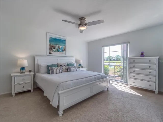 a spacious bedroom with a bed and a window