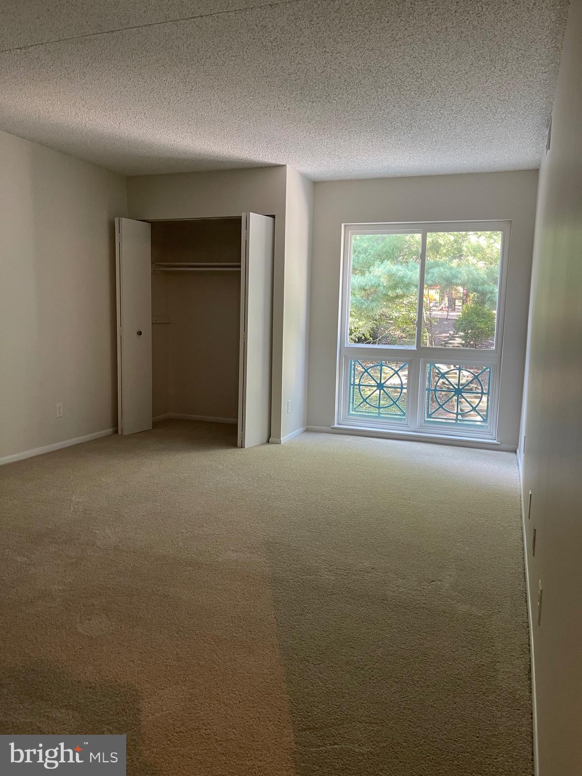 11837 Shire Court, Unit 22 Reston, VA 20191 - Photo 9 of 14 a view of an empty room with a window