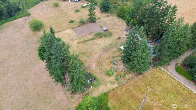 an aerial view of residential house with outdoor space and lake view