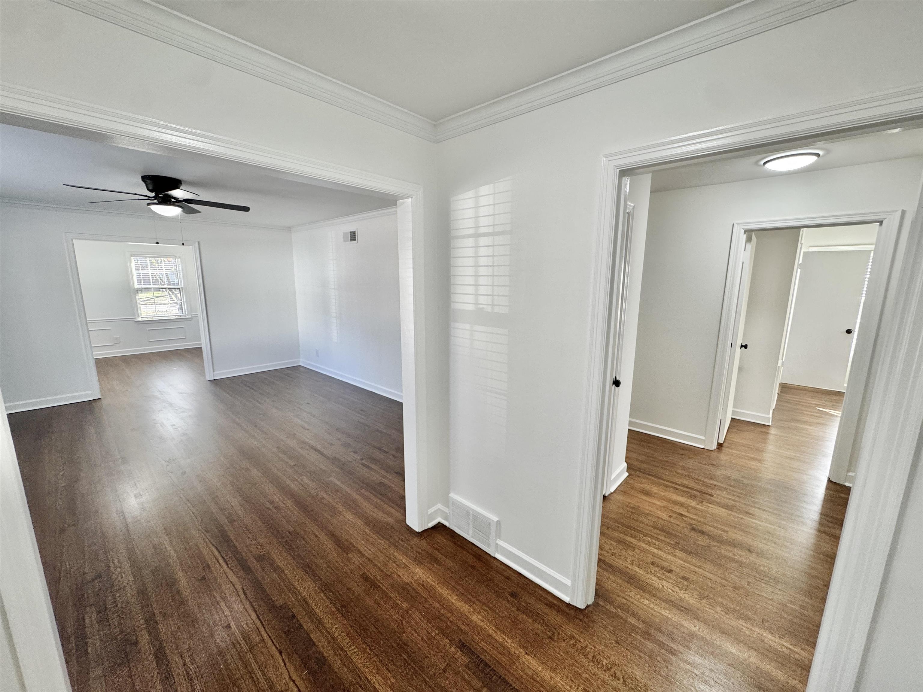 4417 Fair Meadow Road Memphis, TN 38117 - Photo 11 of 38 an empty room with wooden floor and windows