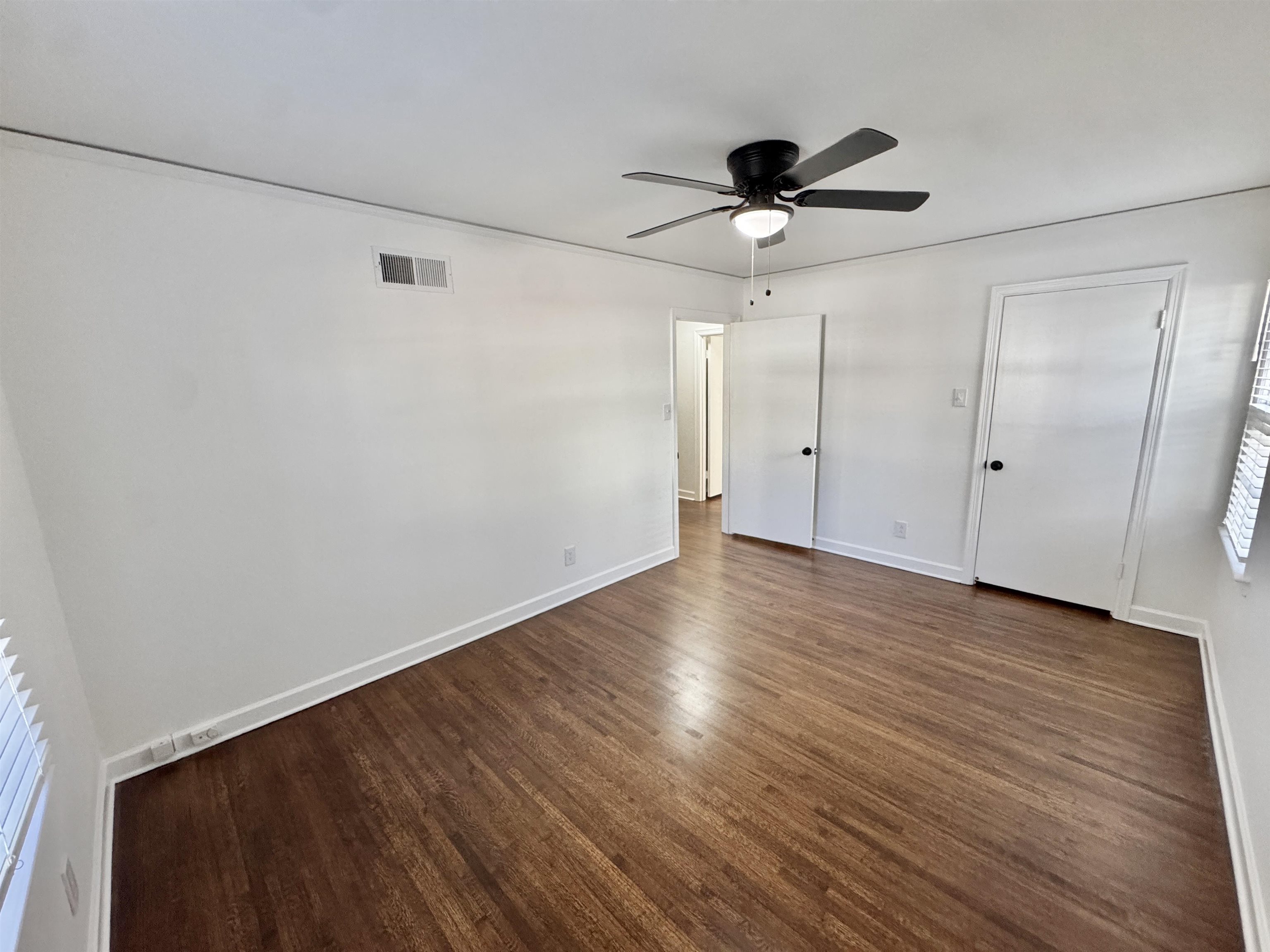 4417 Fair Meadow Road Memphis, TN 38117 - Photo 23 of 38 a view of a room with wooden floor a ceiling fan and window