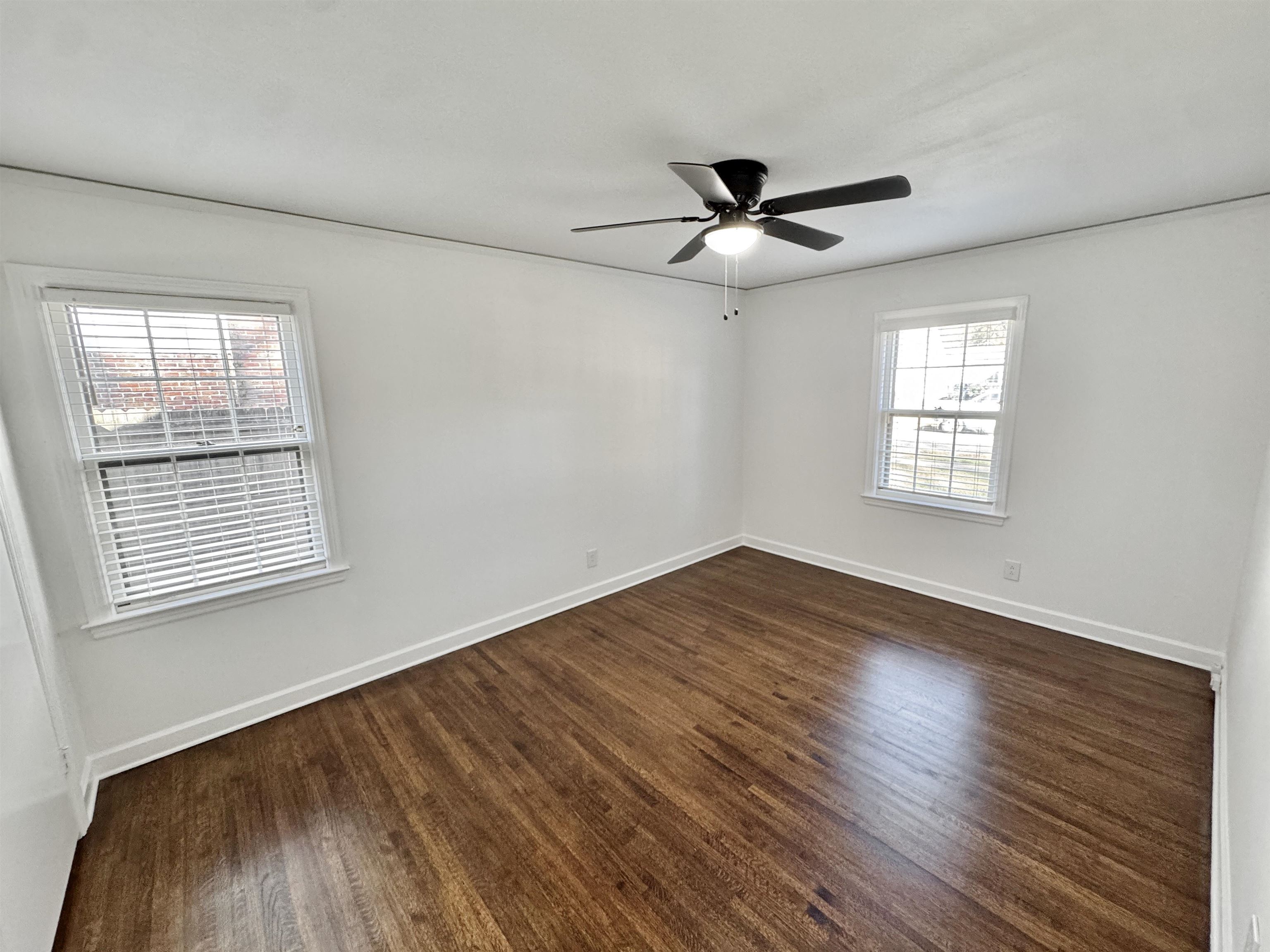 4417 Fair Meadow Road Memphis, TN 38117 - Photo 26 of 38 a view of empty room with wooden floor and fan