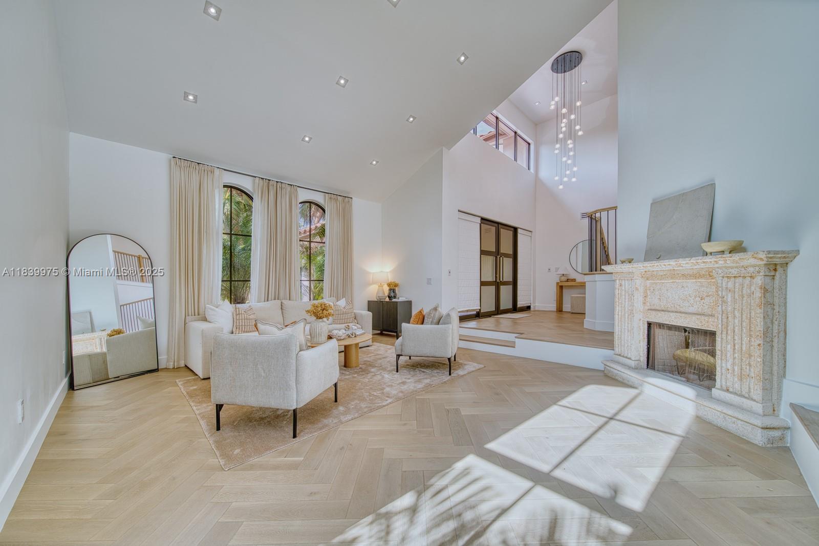 12480 Southwest 97th Street Miami, FL 33186 - Photo 16 of 64 a living room with furniture and a fireplace
