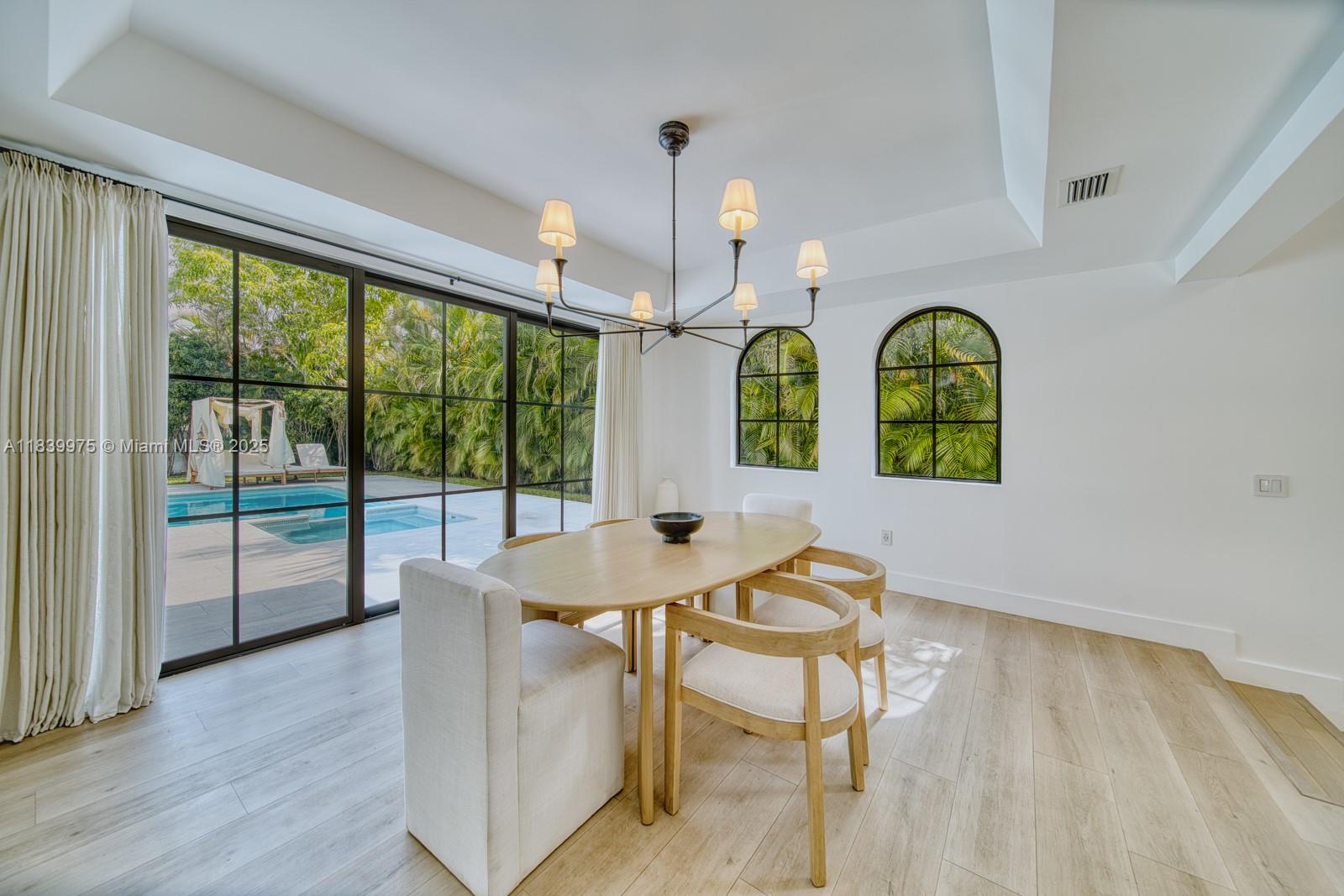 12480 Southwest 97th Street Miami, FL 33186 - Photo 20 of 64 a view of a dining room with furniture and window