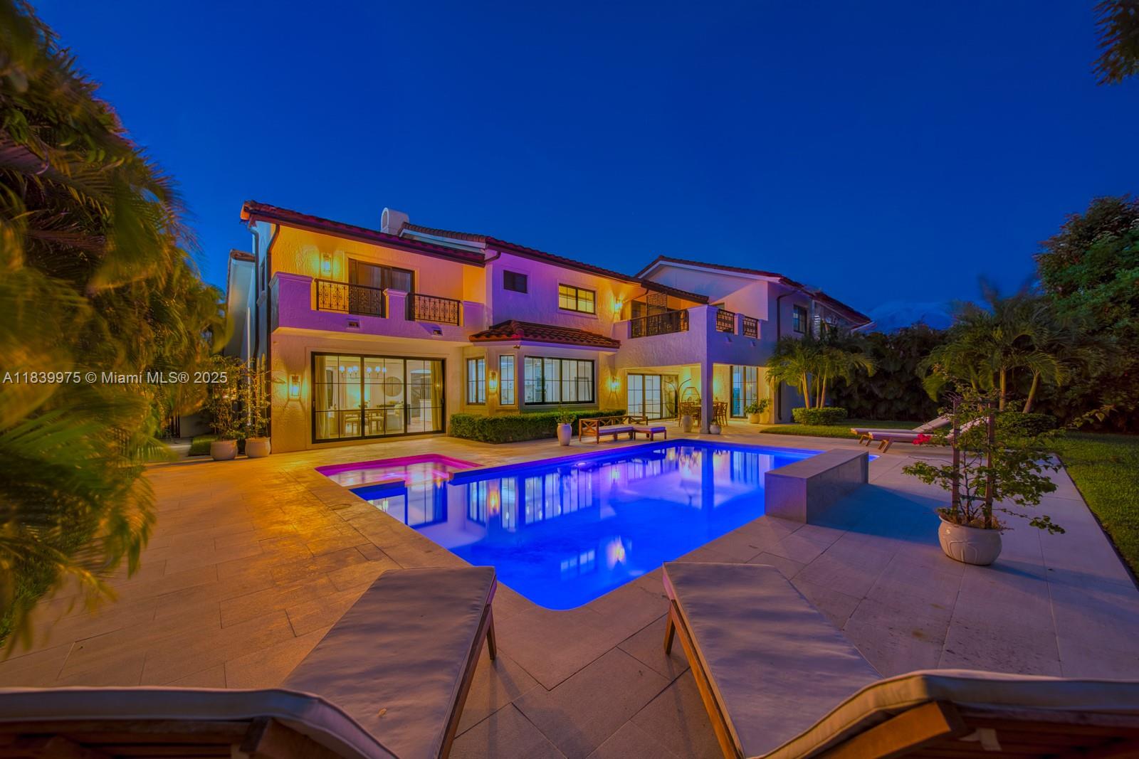 12480 Southwest 97th Street Miami, FL 33186 - Photo 2 of 64 a view of swimming pool with red chairs