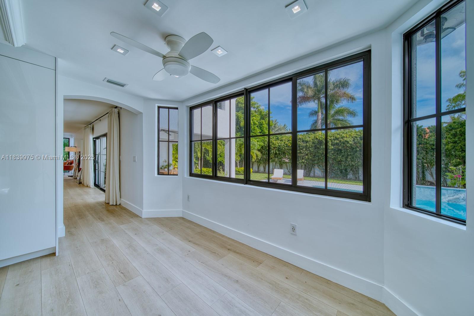 12480 Southwest 97th Street Miami, FL 33186 - Photo 24 of 64 a view of hallway with a large window and chandelier