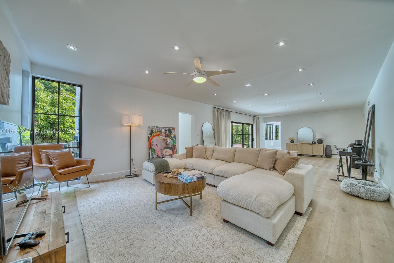 12480 Southwest 97th Street Miami, FL 33186 - Photo 27 of 64 a living room with furniture and a large window