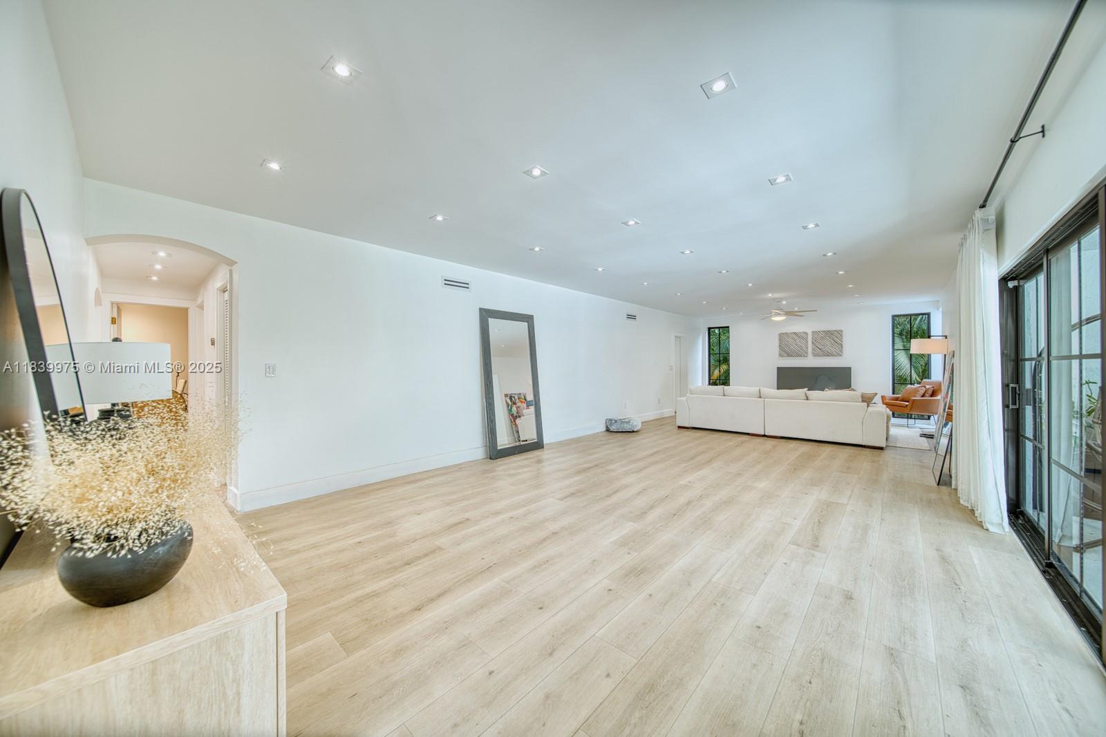 12480 Southwest 97th Street Miami, FL 33186 - Photo 29 of 64 a view of empty room with wooden floor