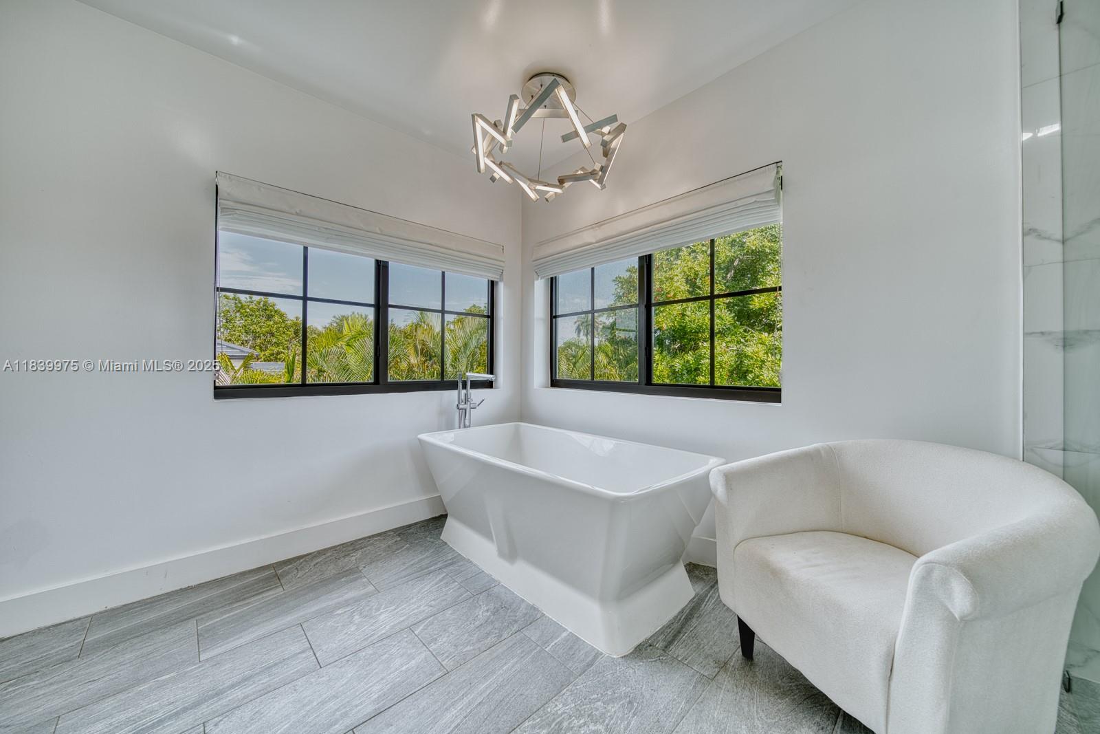 12480 Southwest 97th Street Miami, FL 33186 - Photo 36 of 64 a bathroom with a sink and a large window