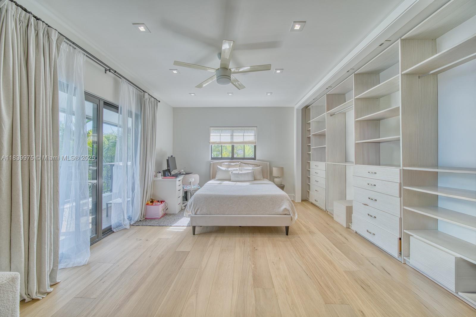 12480 Southwest 97th Street Miami, FL 33186 - Photo 39 of 64 a spacious bedroom with a bed and a window