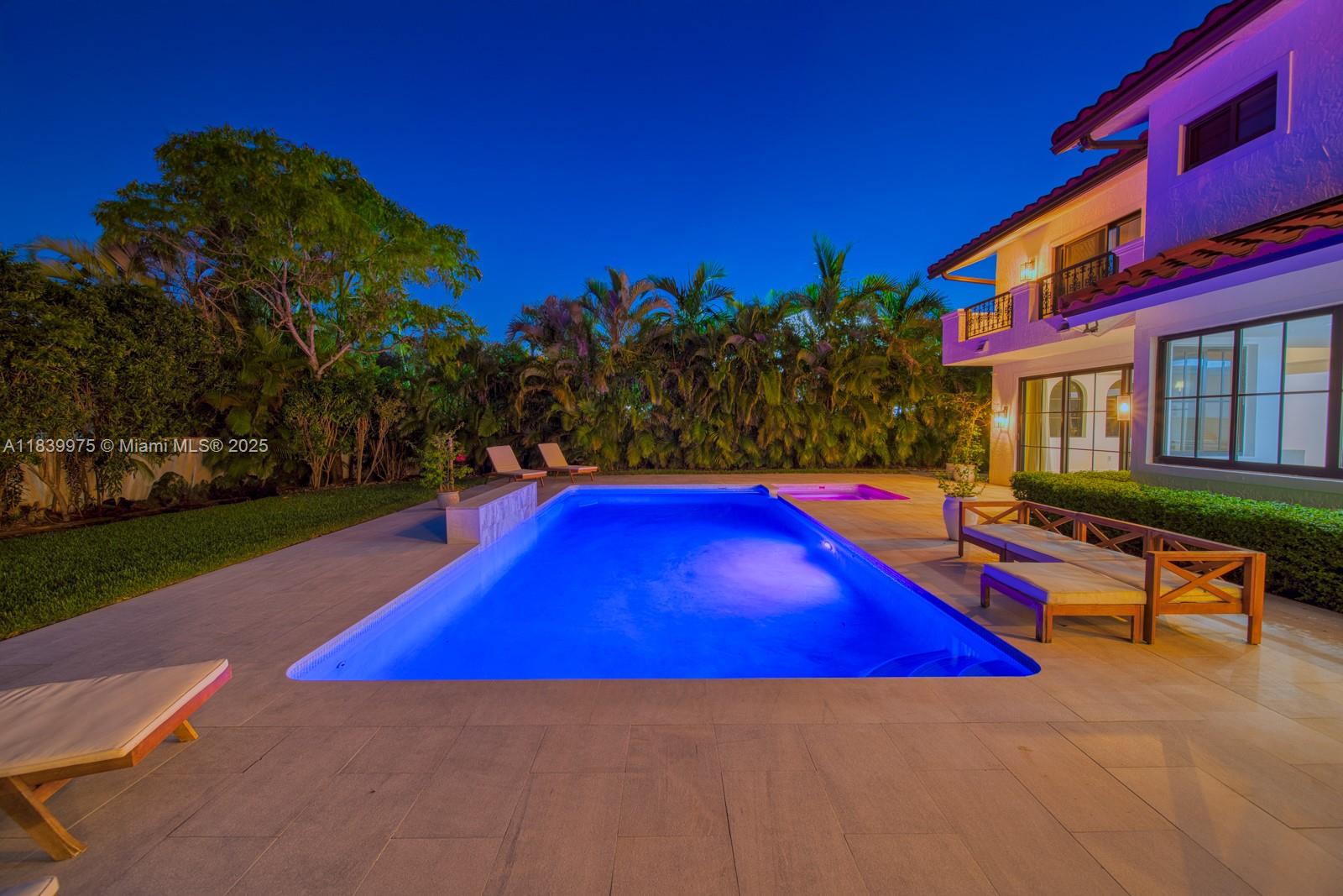 12480 Southwest 97th Street Miami, FL 33186 - Photo 4 of 64 a view of swimming pool with red chairs