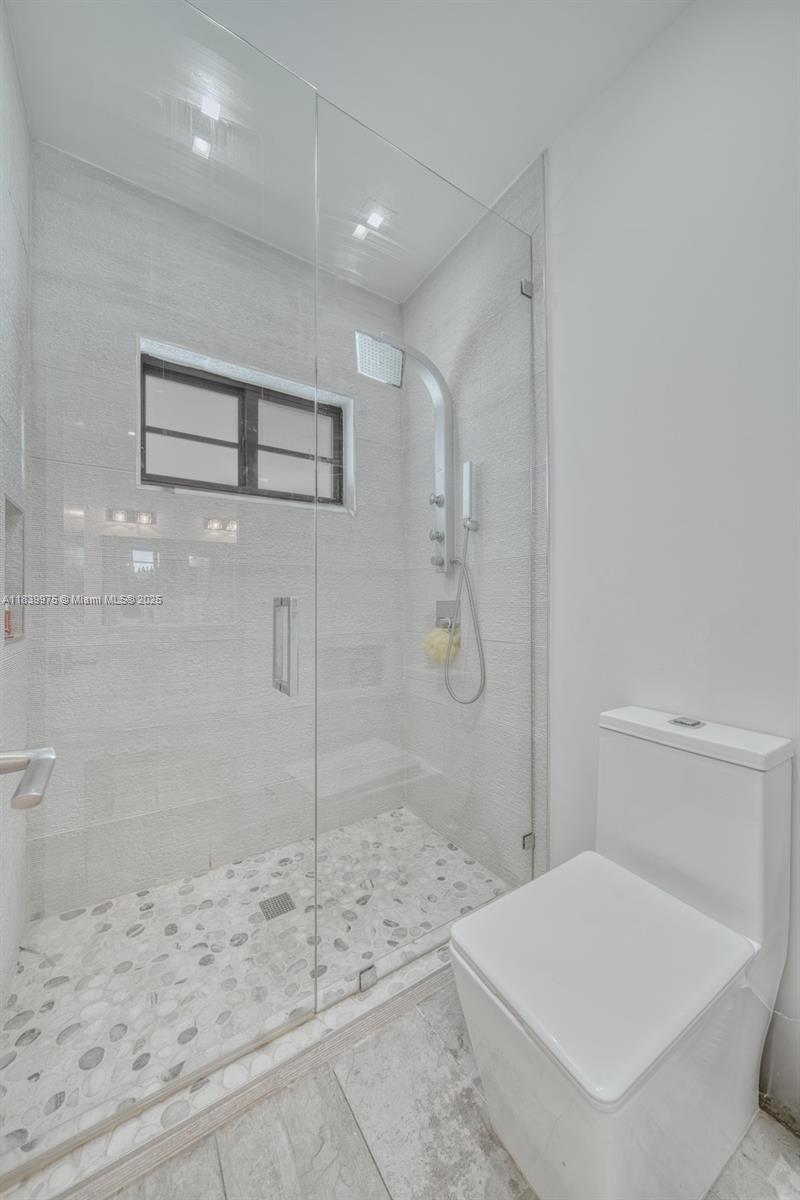 12480 Southwest 97th Street Miami, FL 33186 - Photo 41 of 64 a bathroom with a sink and a shower