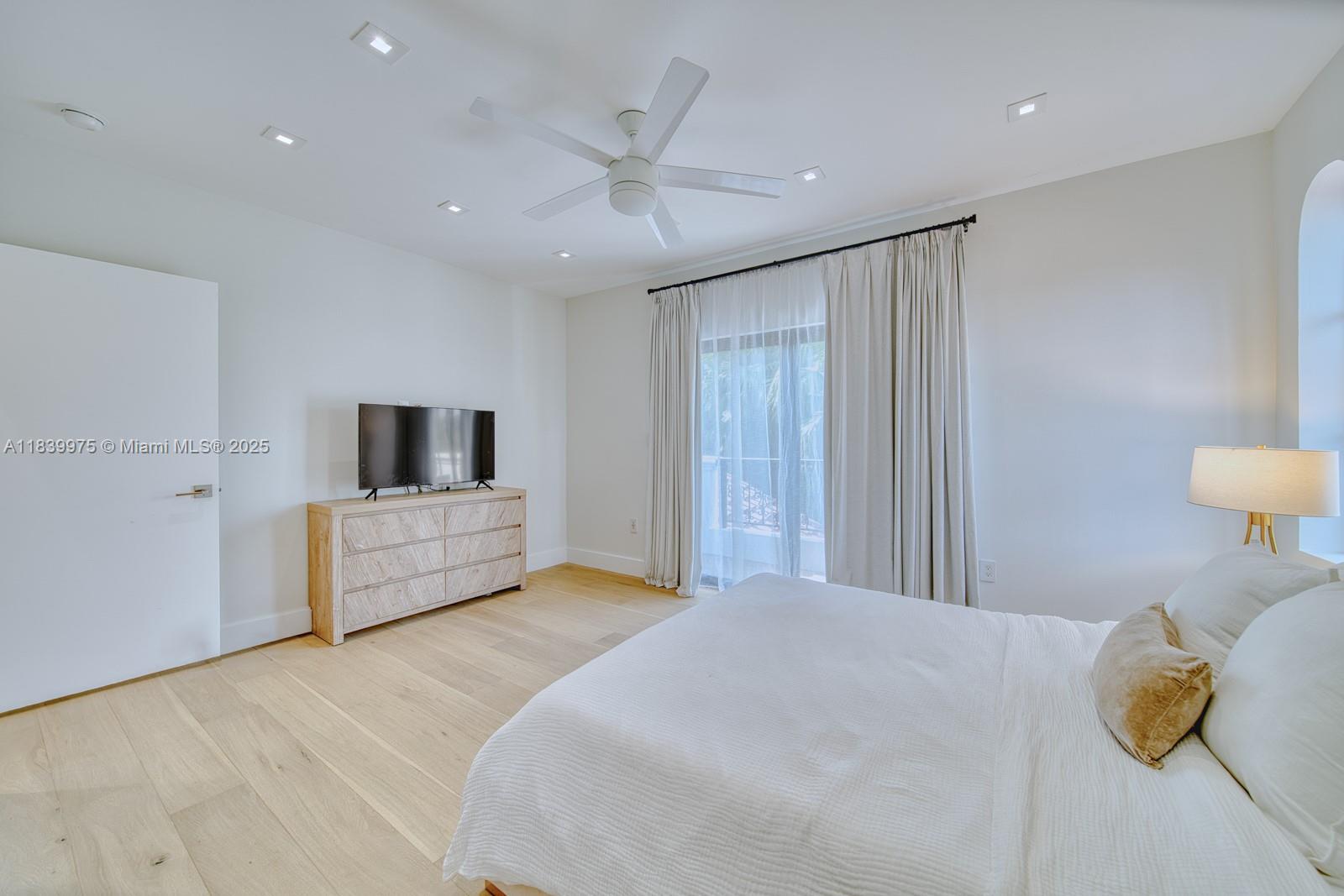 12480 Southwest 97th Street Miami, FL 33186 - Photo 43 of 64 a bedroom with a large bed and a large window