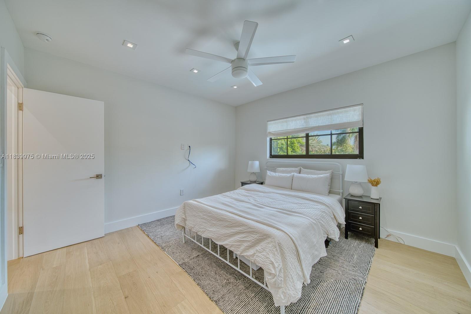 12480 Southwest 97th Street Miami, FL 33186 - Photo 50 of 64 a bedroom with a bed and a window