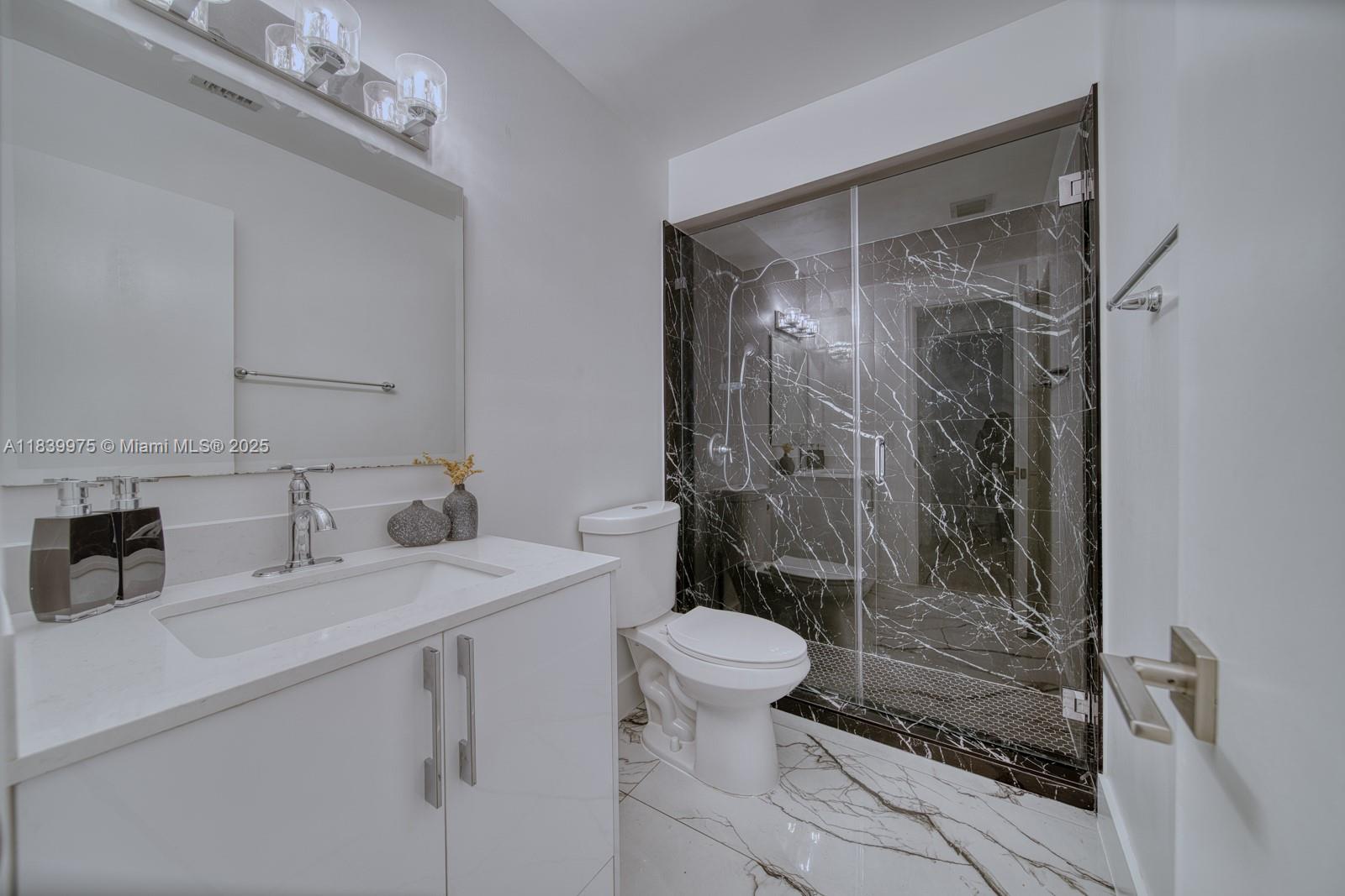 12480 Southwest 97th Street Miami, FL 33186 - Photo 51 of 64 a bathroom with a sink toilet and shower