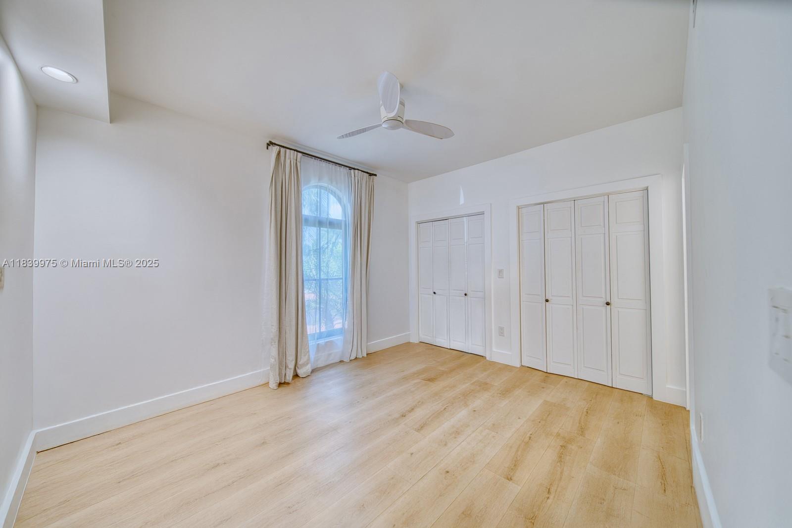 12480 Southwest 97th Street Miami, FL 33186 - Photo 52 of 64 a view of an empty room and chandelier fan