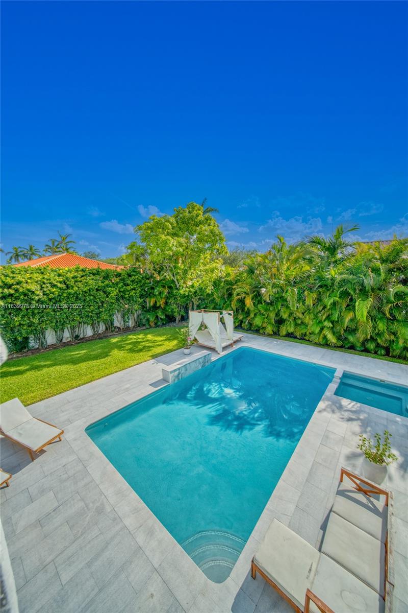 12480 Southwest 97th Street Miami, FL 33186 - Photo 58 of 64 a view of a swimming pool with an outdoor space and seating area