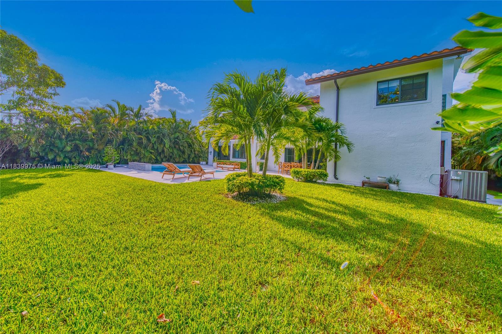 12480 Southwest 97th Street Miami, FL 33186 - Photo 59 of 64 a view of a swimming pool with a yard and palm trees