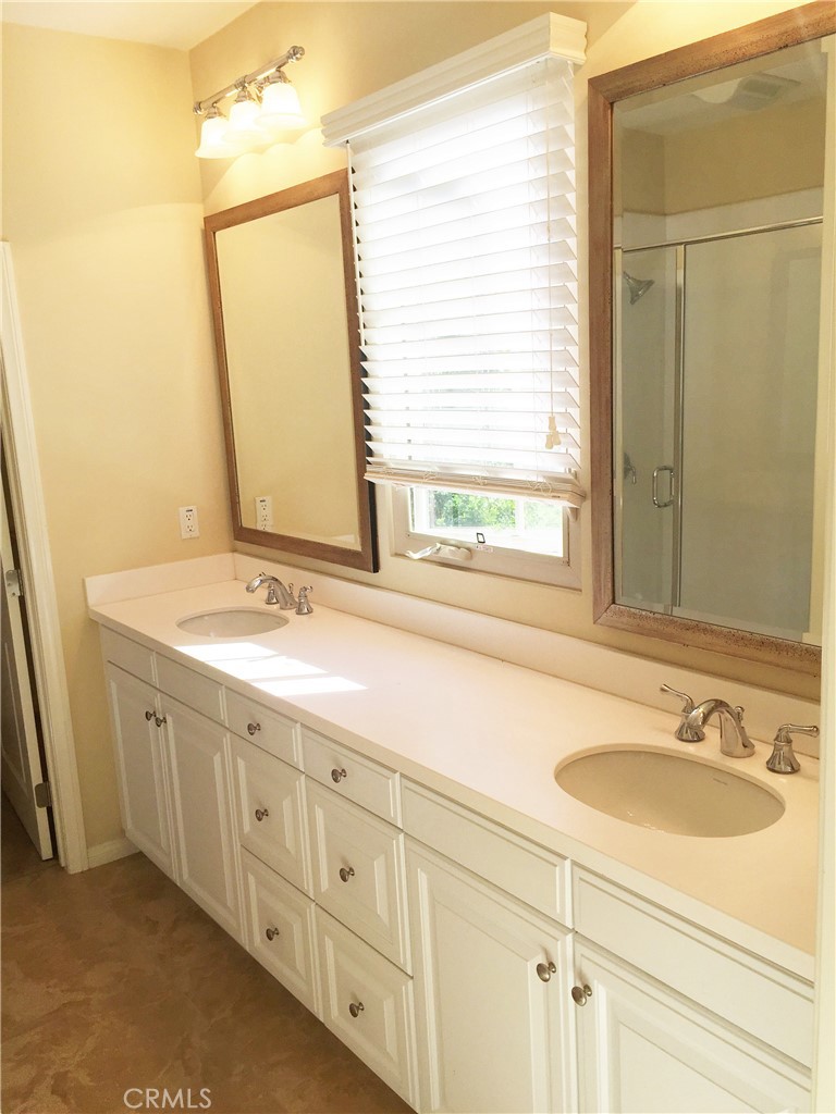 36 Brindisi Irvine, CA 92618 - Photo 12 of 44 a bathroom with double sink and a mirror