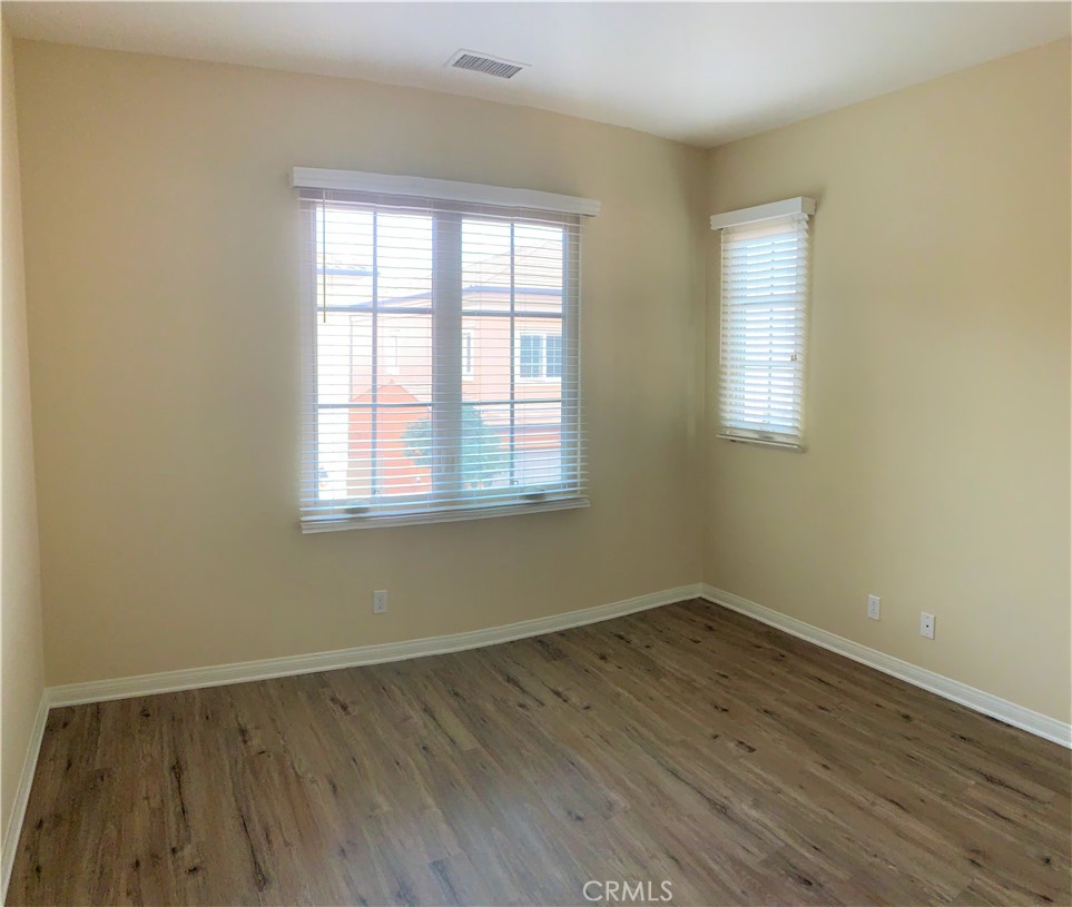 36 Brindisi Irvine, CA 92618 - Photo 13 of 44 an empty room with wooden floor and windows