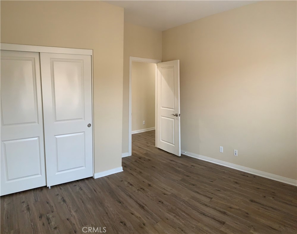 36 Brindisi Irvine, CA 92618 - Photo 14 of 44 a view of an empty room with wooden floor