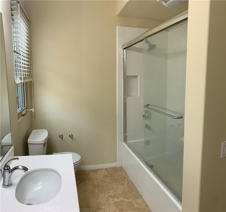 36 Brindisi Irvine, CA 92618 - Photo 20 of 44 a bathroom with a toilet and a sink