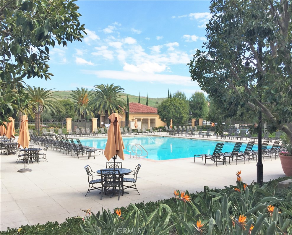 36 Brindisi Irvine, CA 92618 - Photo 26 of 44 a view of a lake with a table and chairs