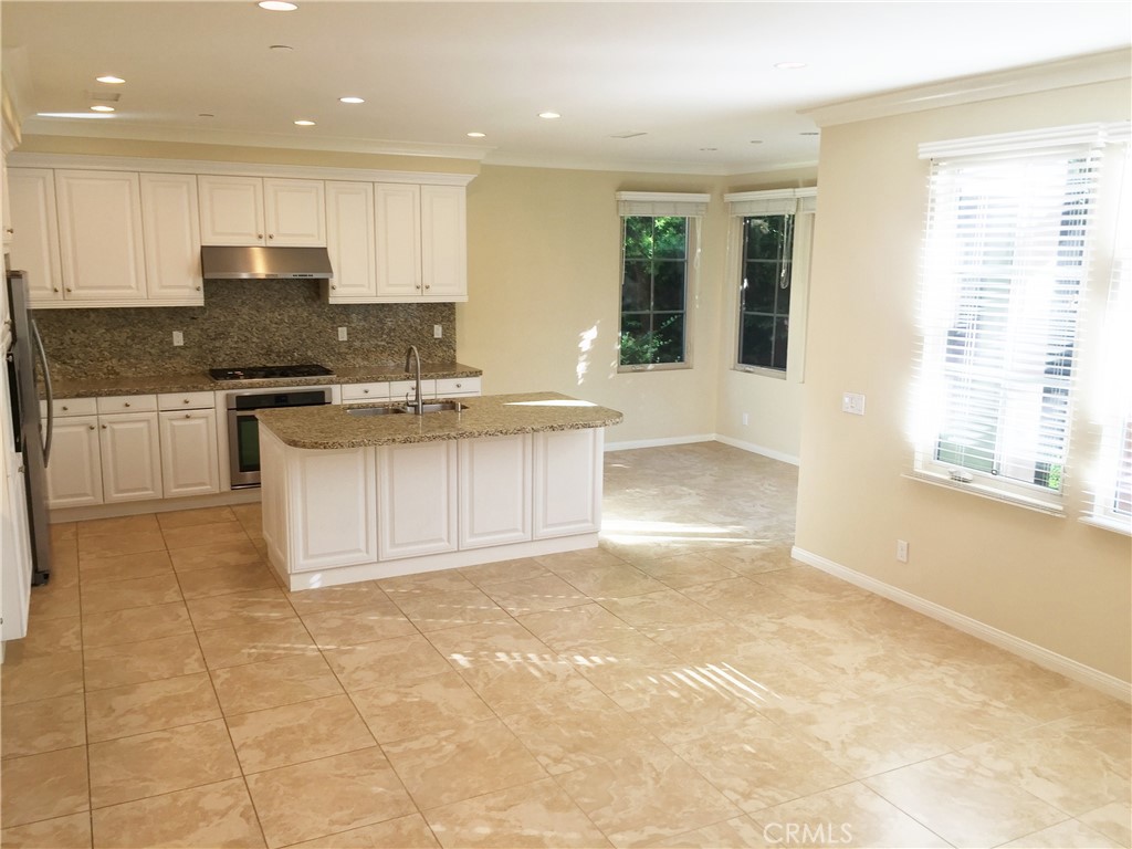36 Brindisi Irvine, CA 92618 - Photo 5 of 44 a kitchen with a sink cabinets and window