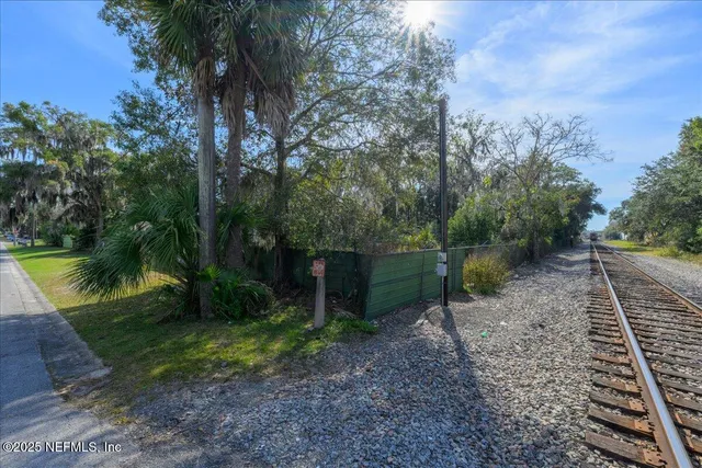 a backyard of a house with lots of green space