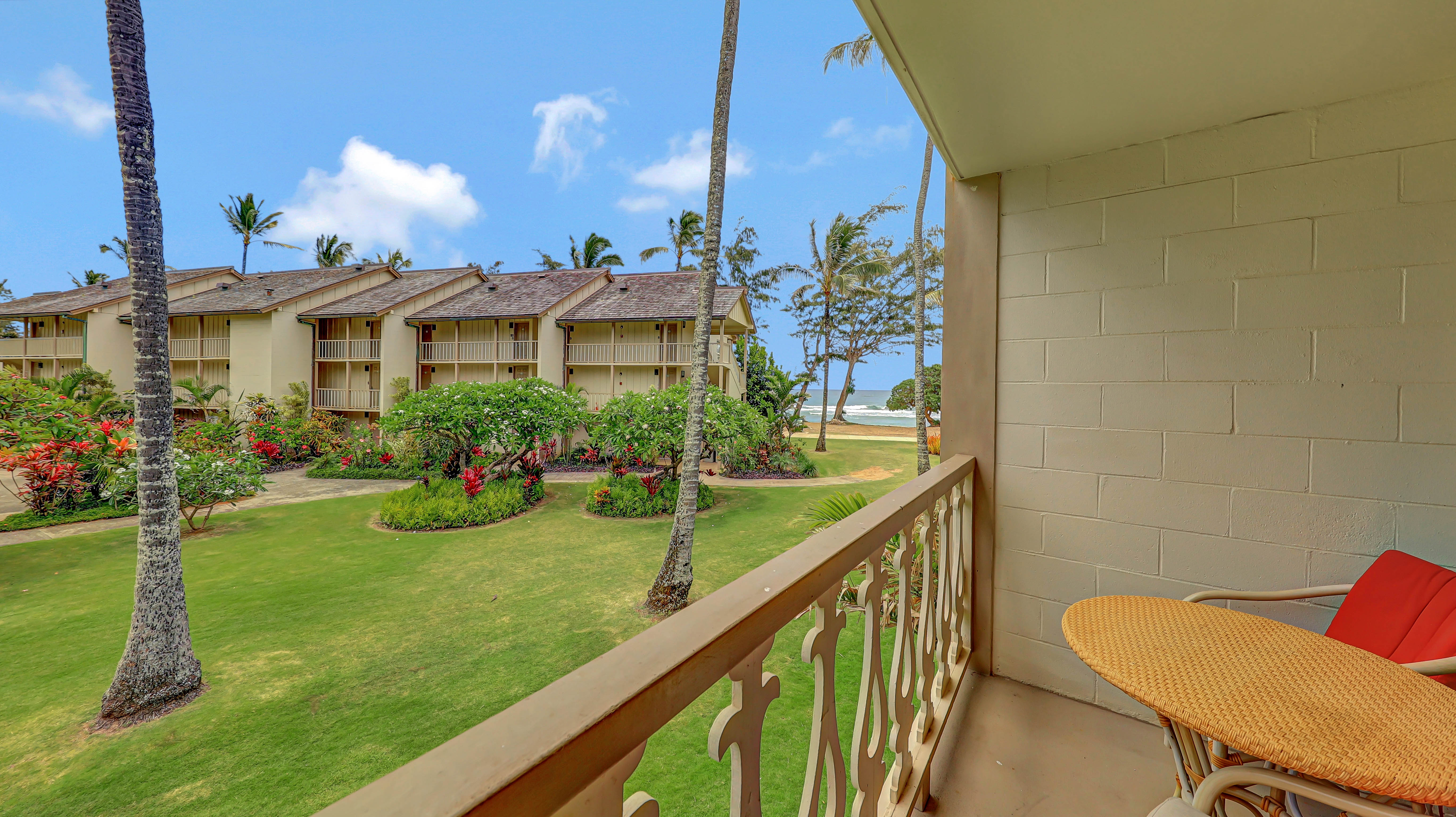 440 Aleka Place, Unit 256 Kapaa, HI 96746 - Photo 12 of 27 a view of a chair and tables in the patio next to a yard