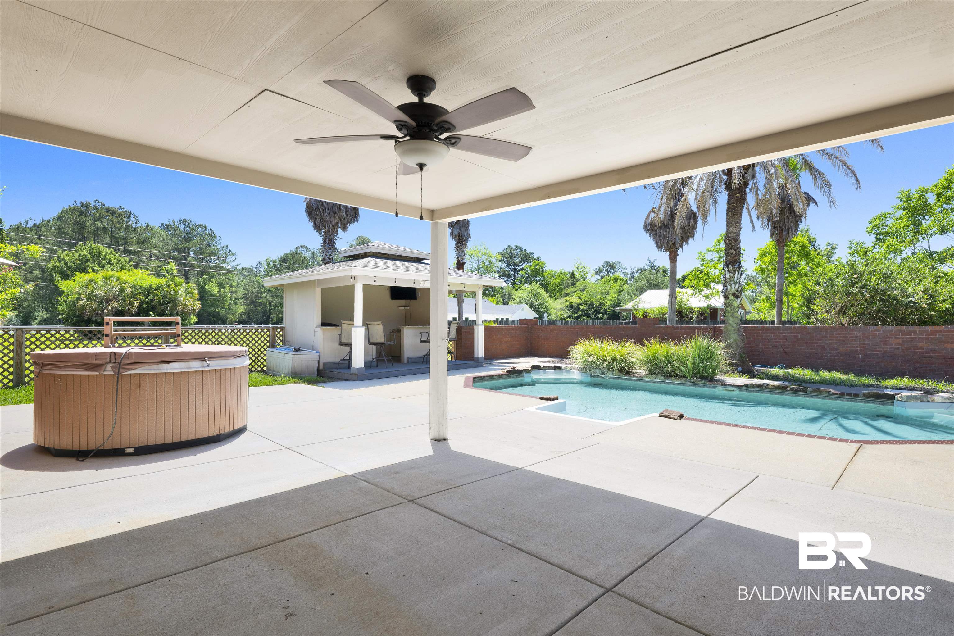 12944 Anna's Way Stapleton, AL 36578 - Photo 31 of 64 Expansive outdoor living area featuring a covered patio with ceiling fan, a built-in swimming pool, and a dedicated hot tub area