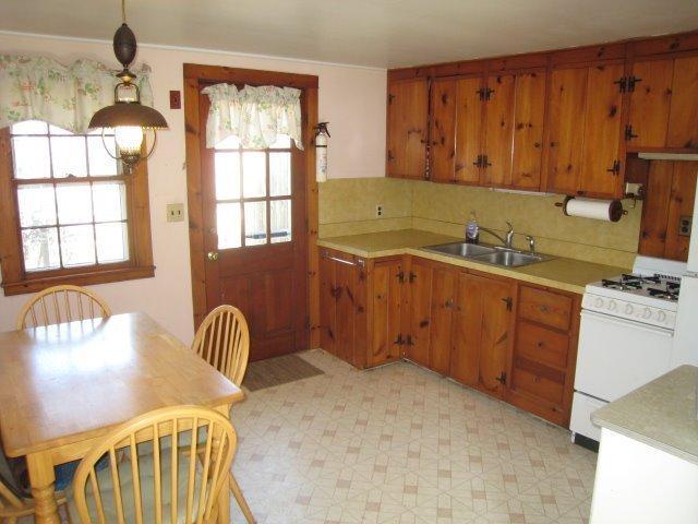 84 Uncle Rolf Road Dennis Port, MA 02639 - Photo 5 of 16 a kitchen with sink cabinets and window